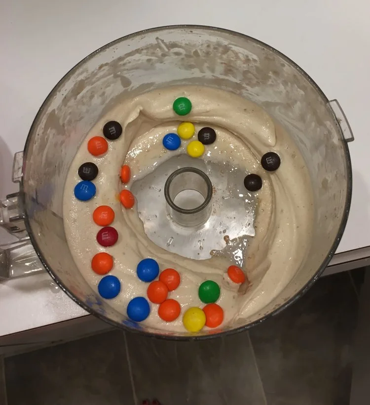 My most recent "smoothie". I'm pretty sure this is not what the health blogs were talking about. You want the recipe? Ok! Frozen banana, cinnamon, a dash of almond milk (for health), cocoa powder. Blend in food processor. Add M and M's. Sprinkles or chocolate syrup would also work. 