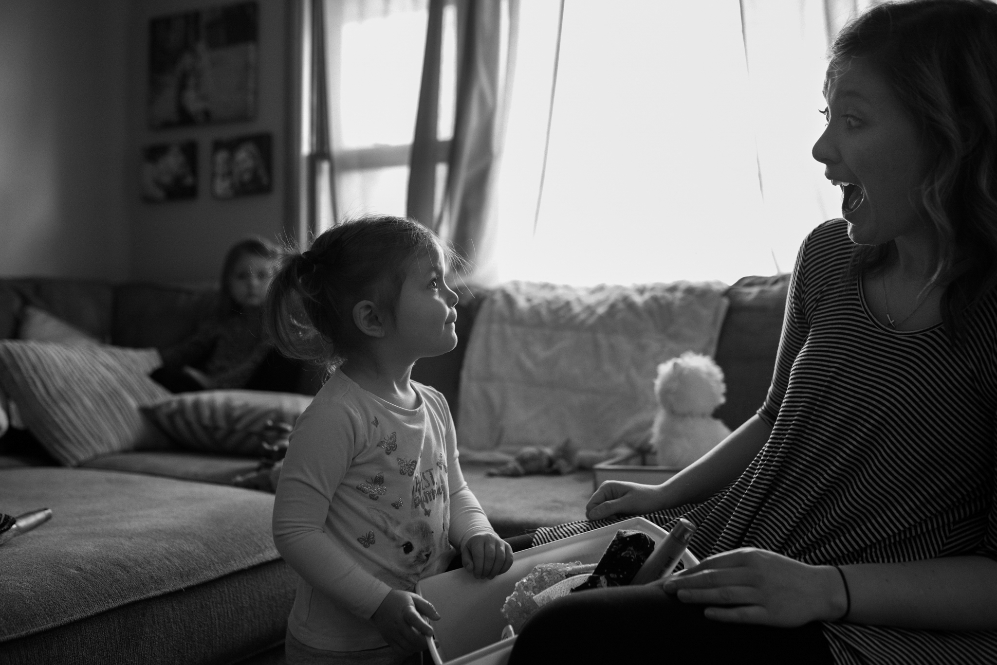 Daughter looks at mom, mom looks at daughter with surprised face