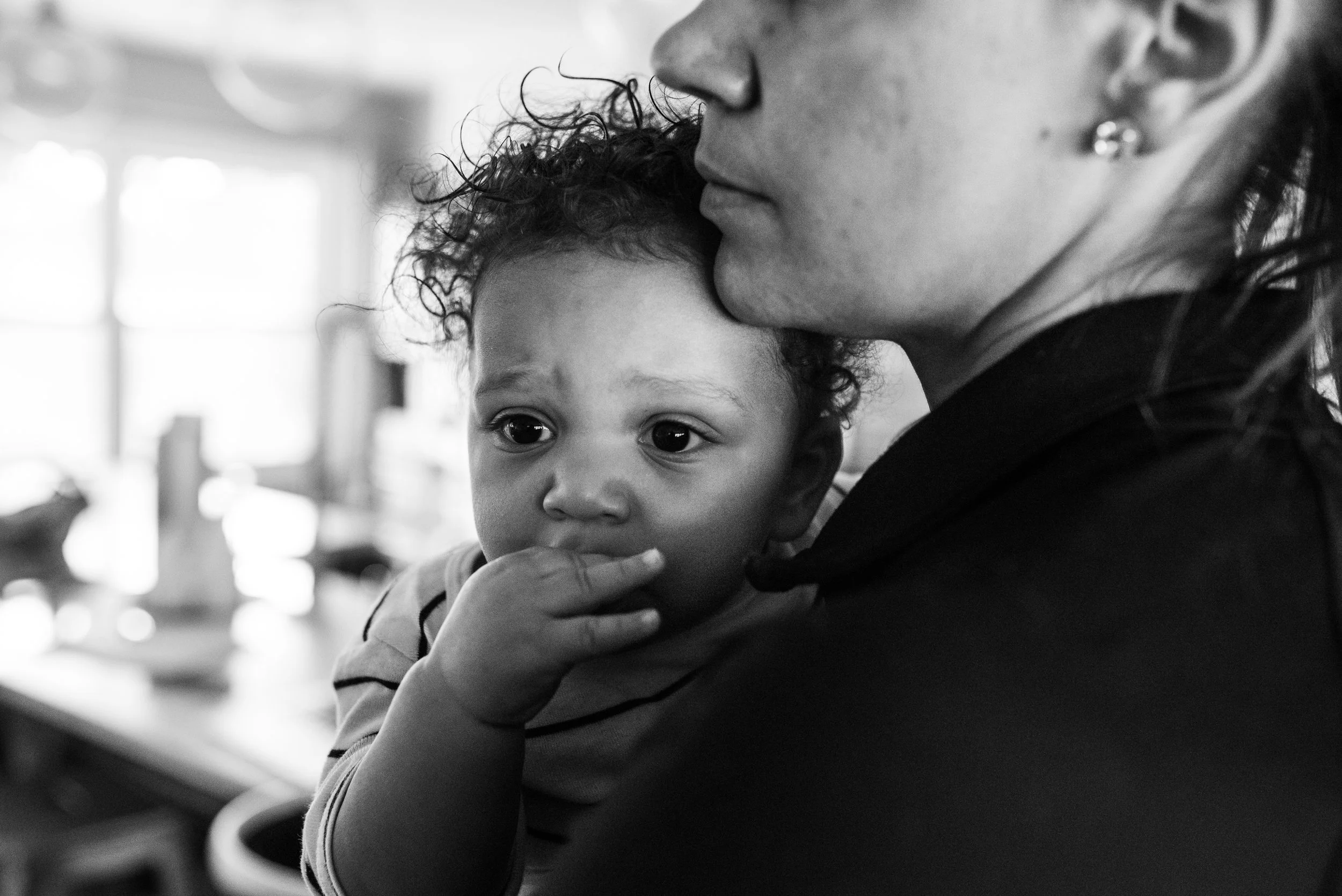 Mom holding and resting chin on son