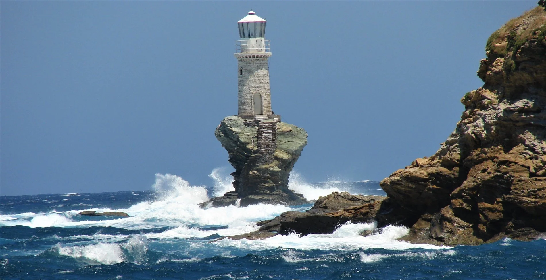 The impressive Tourlitis lighthouse of Andros island, Greece. Source: Alphacoders