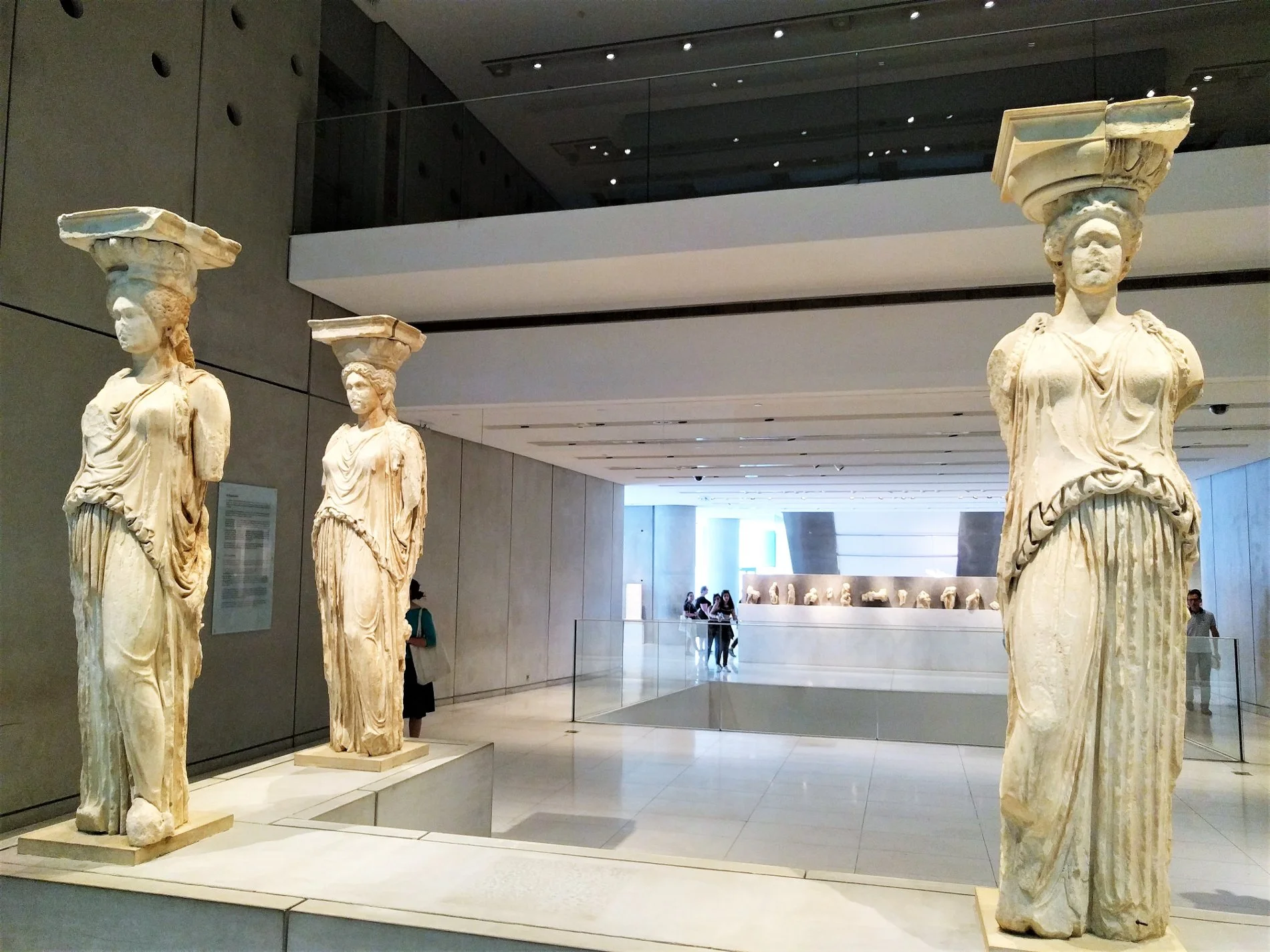 Inside the Acropolis Museum, you can see the Caryatids, some of the most intact exhibits of the Erechtheum, one of the Acropolis buildings.
