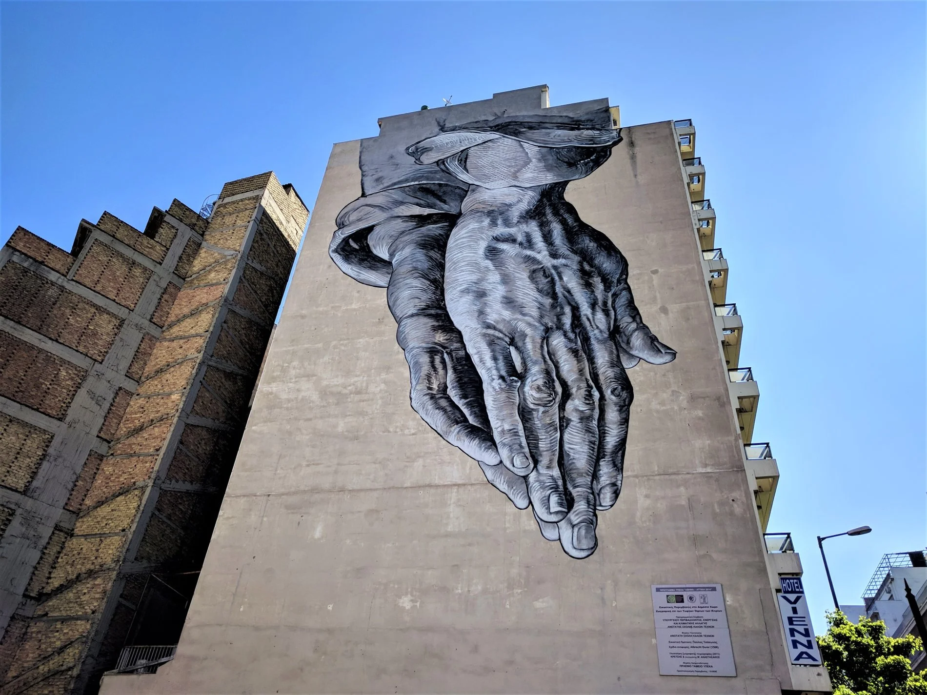 'Praying Hands' by Pavlos Tsakonas can be found on Pireaios Street in Athens.