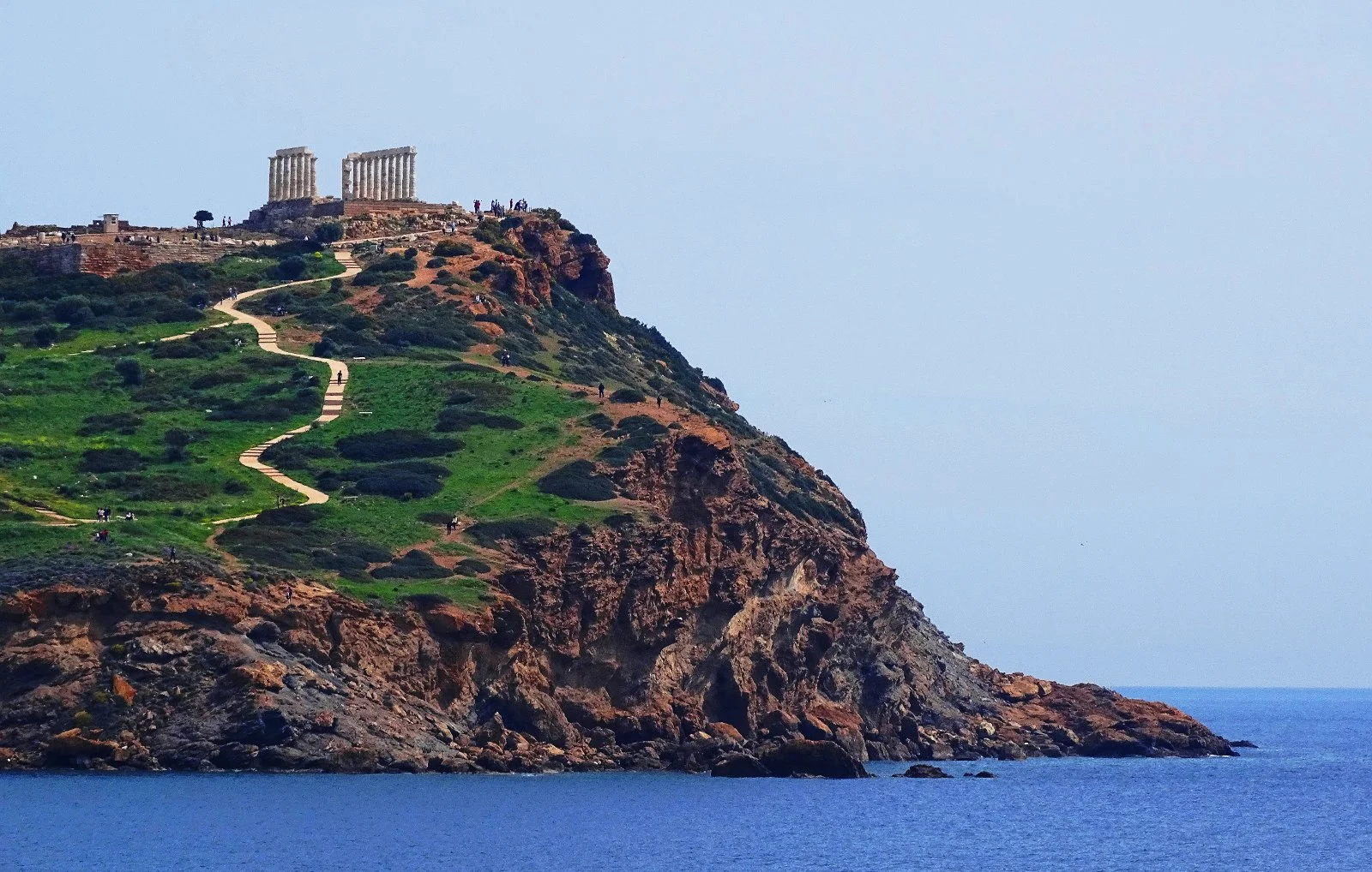 The magnificent Temple of Poseidon, as viewed from Pasalimani beach in Sounio. Source: cindyknoke.com