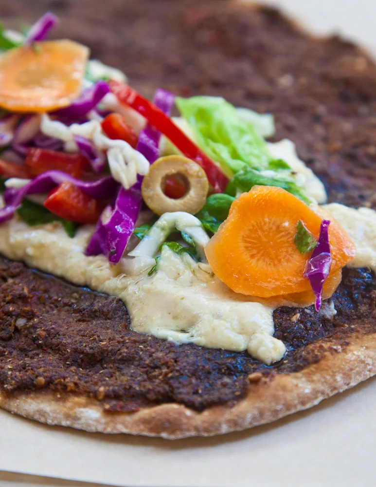 Delicious vegeterian lahmajoun with hummus. Source: Feyrouz
