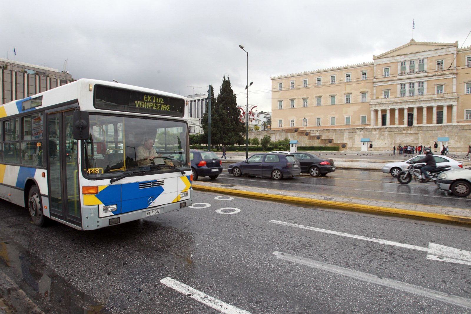 According to a new law in 2018, you can only enter the buses from the front door. Here, a bus passing in front of the Greek parliament.