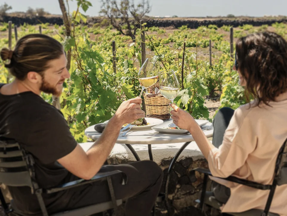 Enjoy a glass of the white wine of Santorini