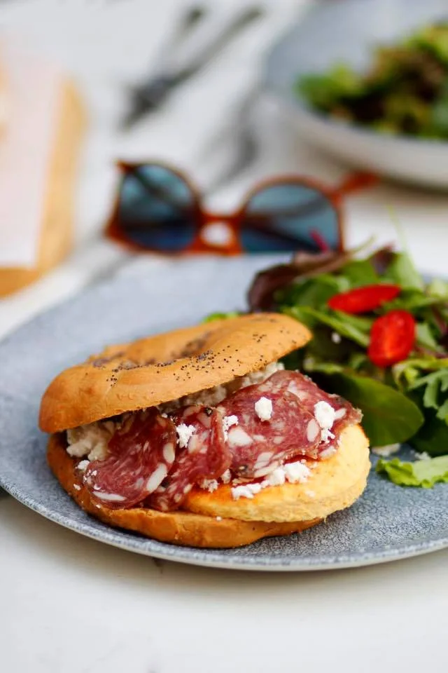 Who can say ‘no’ to a bagel made entirely of local Greek products? Source: Beauty killed the beast