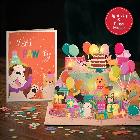 LP12675_Birthday_Pawty_Pups_Music_and_Lights_Pop-Up_Card_Lifestyle_dbd57536-a184-4e56-ad4c-a623edcec41f.webp