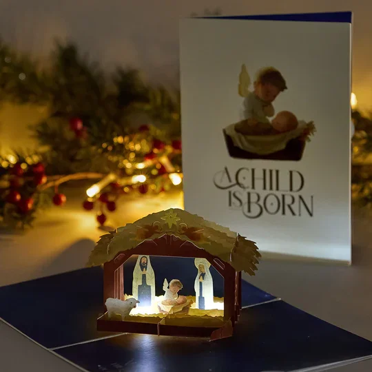 LP5794_A_Child_is_Born_Nativity_Light-Up_Pop-Up_Card_Lifestyle_c6b9539b-2436-4ba0-b77e-9e21070af043.webp