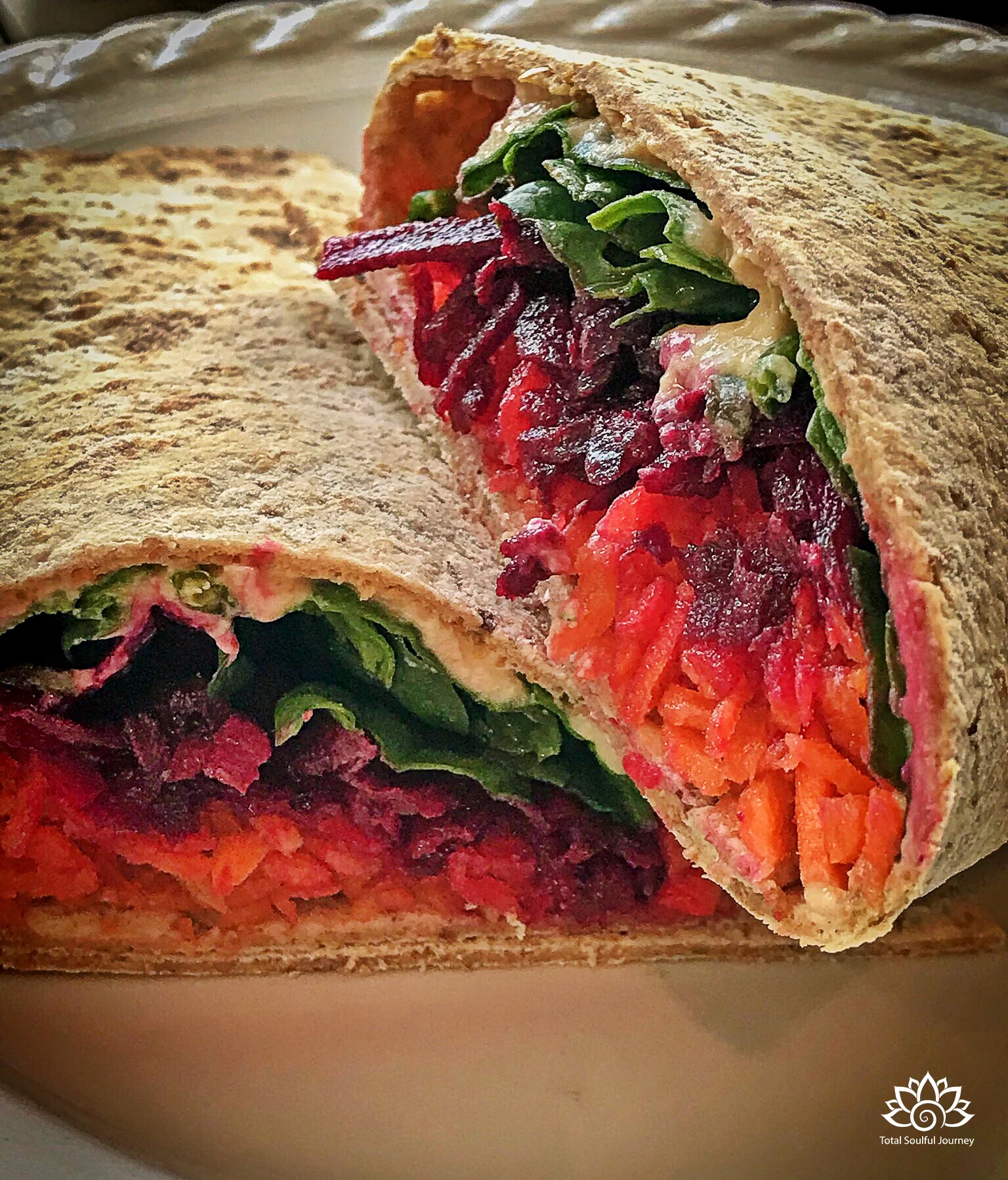 Vegetarian sandwiches do not have to be tasteless or boring! I pre shredded beets and carrots for the week. This wrap was loaded with love including beets, carrots, spinach, hummus, lemon juice and sunflower seeds.