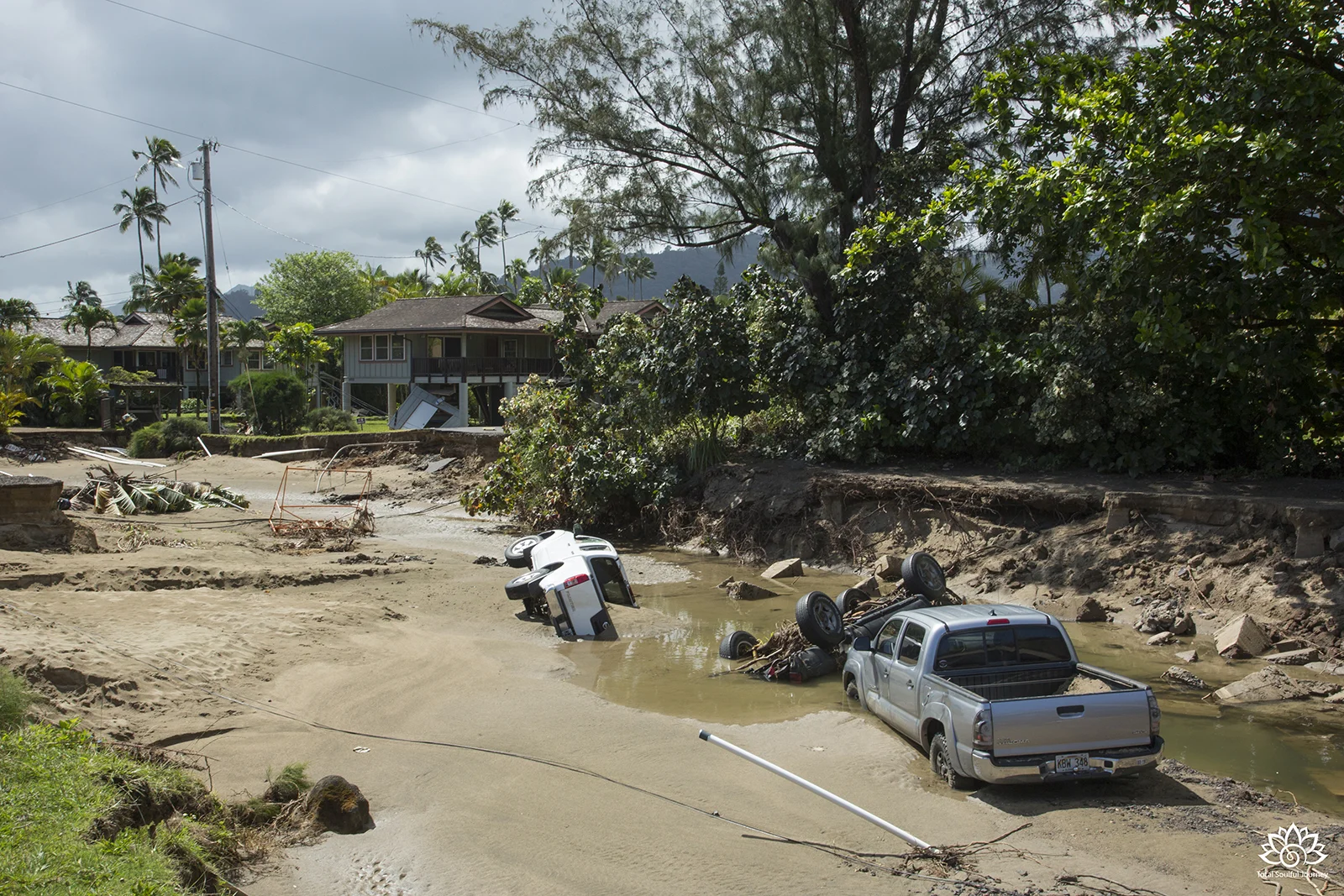 Hanalei on the island of Kauai after a flash flood took out roads and damaged cars and homes in 2018. - Photography by Paul Garrett