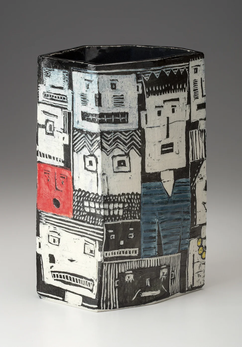 This may be the second “Blockheads” vase. The changes that begin to happen are that the vases become more complicated in form and there continues to be experimentation regarding the best color to black and white ratio. The images are still very loose.
