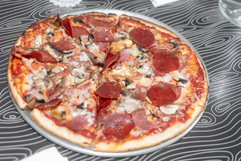 night-kitchen-meat-topped-pizza-small.webp