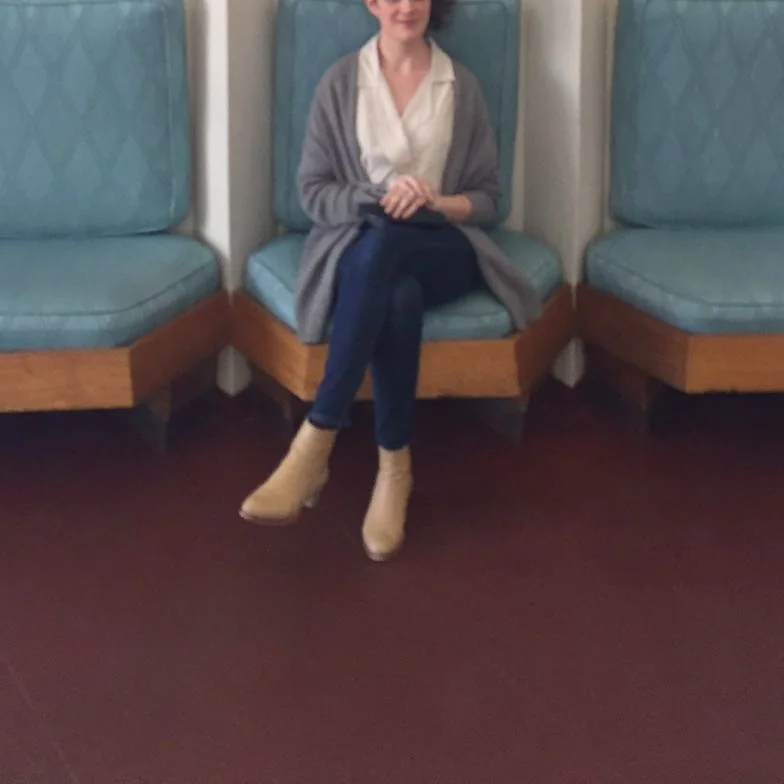 Sitting in the lobby of the Price Tower. Jesse Kamm Newton blouse, Madewell skinny jeans, Veronique Branquinho boots, J. Crew cardigan.