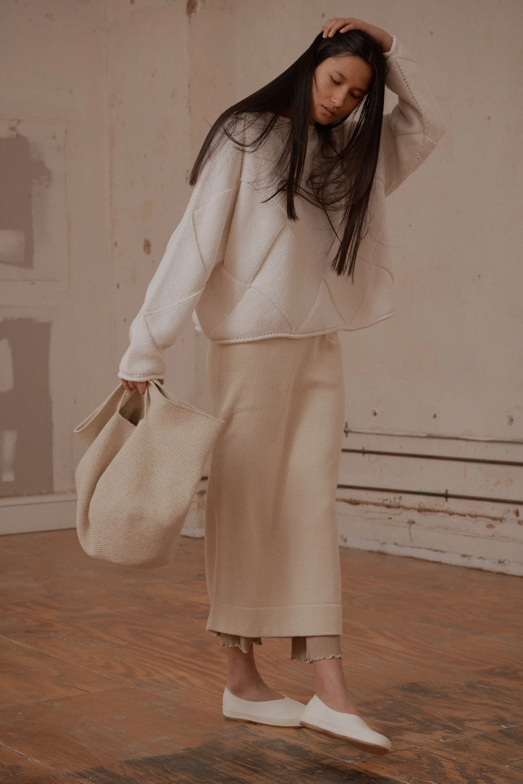 I can so see myself in this sweater. Not so much the sweater skirt over sweater pants with a sweater bag, although the model looks lovely.