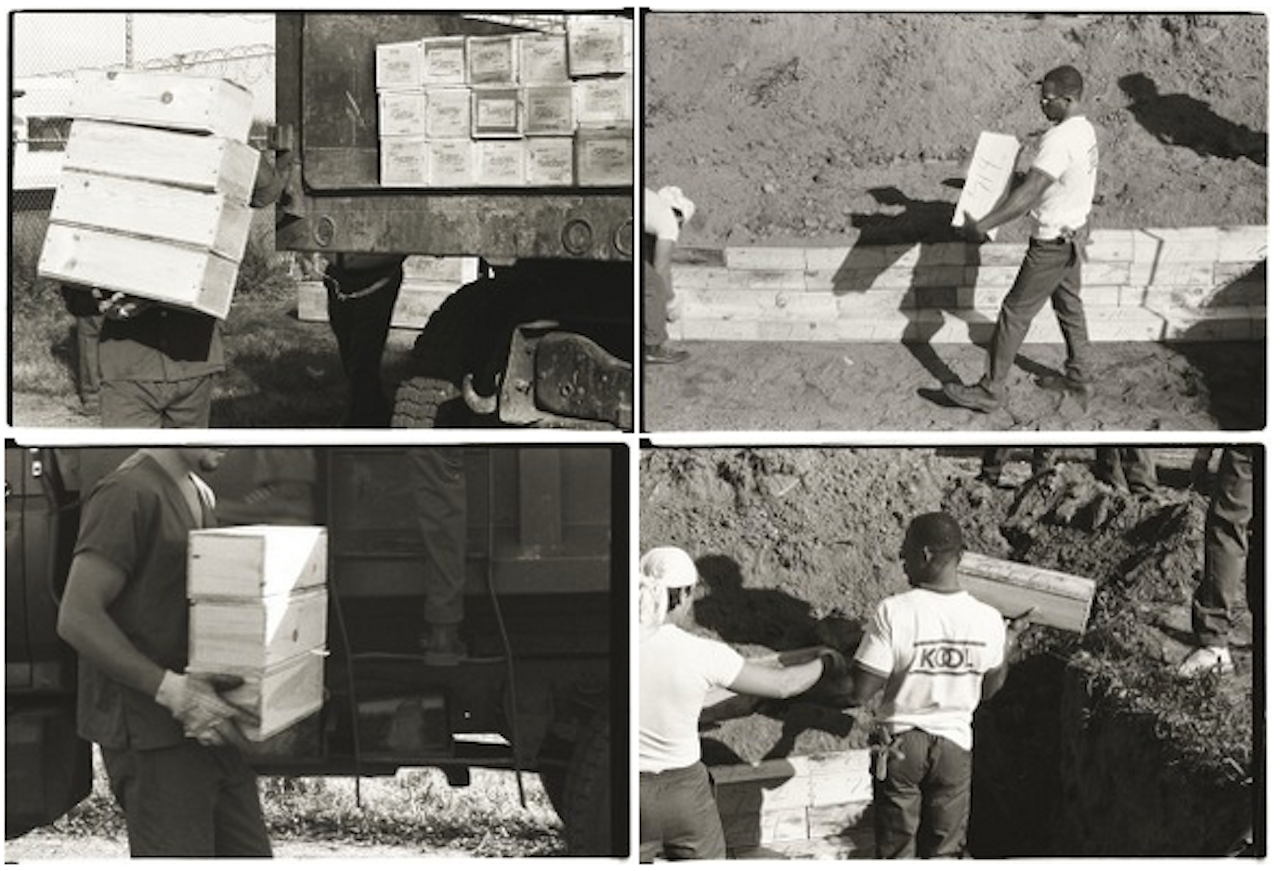 In 1990, workers on Hart Island place coffins in a mass grave for babies, fetuses and amputated body parts © Claire Yaffa, 1990