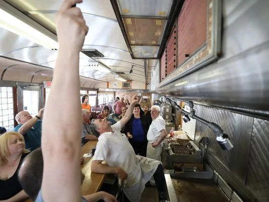 After closing time on Wednesday, the menu board at the Egg Platter was lifted to reveal an old board bearing a bygone menu and low prices from many years ago. Photo: Chris Pedota/NorthJersey.com