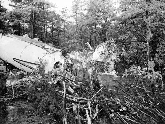 The almost intact main cabin, left, and the completely crushed nose section, center right, of a Douglas Liftmaster transport plane lie in the woods at McGuire Air Force Base, near Fort Dix, after the plane crashed shortly after takeoff on July 13, 1956. Of the 66 people onboard, 45 were killed and 21 injured. The plane was bound for England. Photo: Bill Ingraham/AP