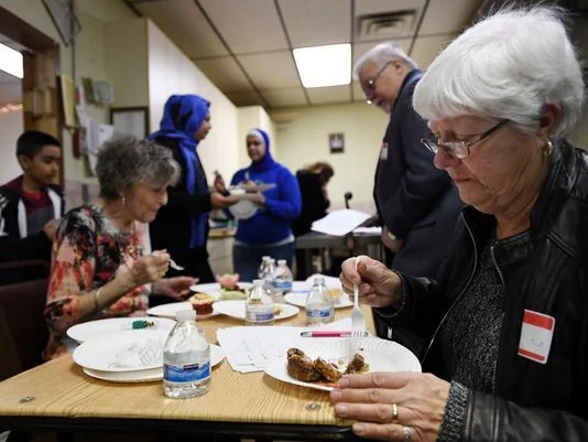 Judy Killman, a judge, tastes a piece of cake. Photo: Michael Karas/Northjersey.com