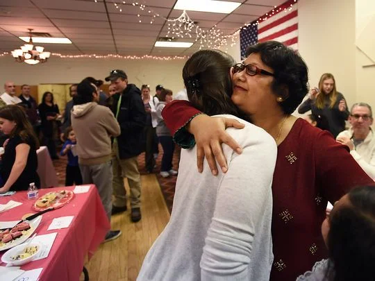Farzana Rahman, right, is congratulated after learning that she won first place for the second year in a row. Photo: Michael Karas/Northjersey.com