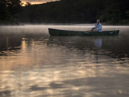 Joan LaDuke fishes on Lake Gerard at sunrise. Photo: Mike Karas/Northjersey.com