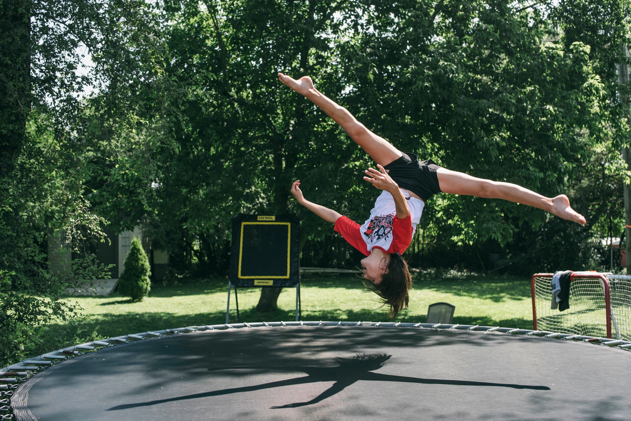  11-year-old Hudson Mulvihill flips on her trampoline in her backyard in Belleville 