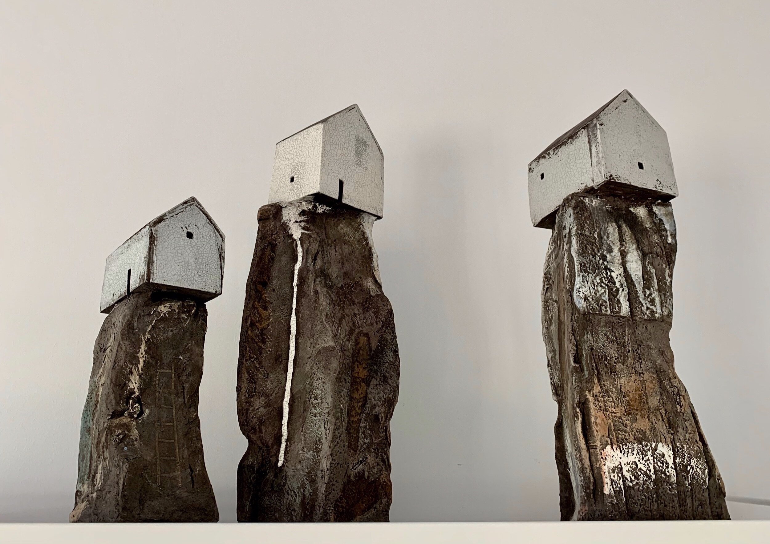 Three house on rock sculptures