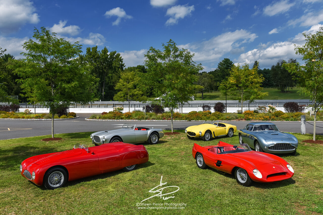  The cars of the featured collectors B.Z. and Michael Schwartz.  Front row (L to R) Cisitalia Nuvolari Spyder &amp; Stanguellini Bialbero Sport. Back row (L to R) Siata 208S Spyder, Moretti 750 Grand Sport &amp; Siata 208 CS Balbo Coupe  .   