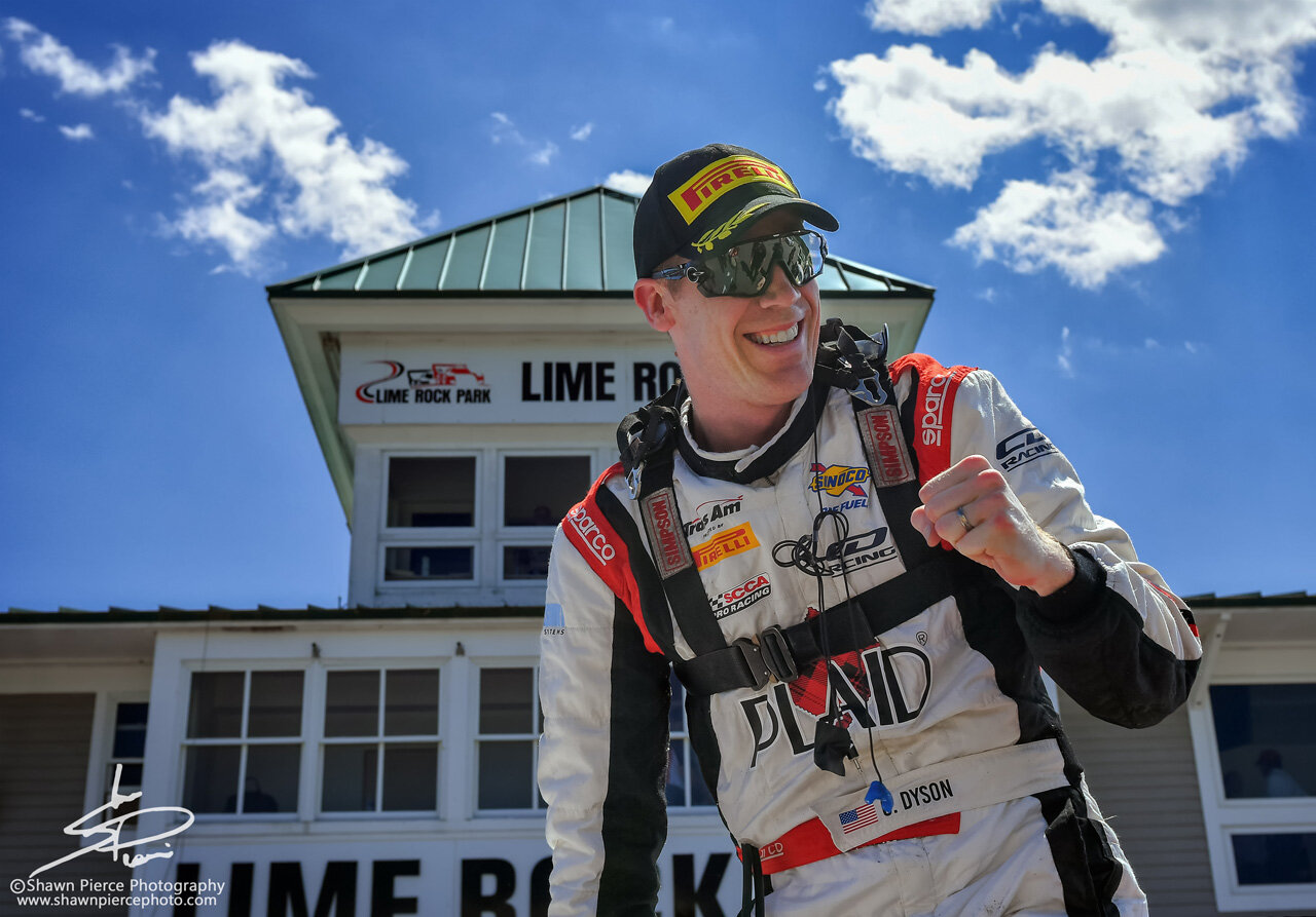  Chris Dyson, winner of the Monday TA race, moments after climbing out of the car.  