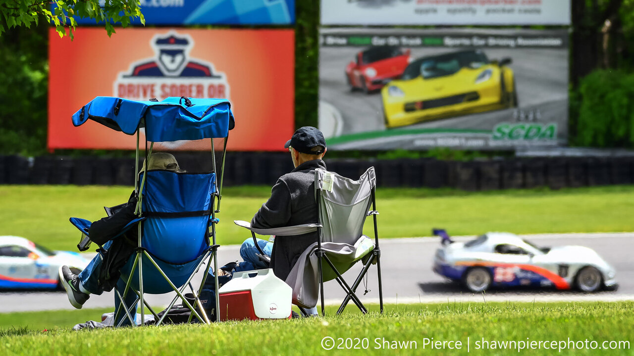  A spectator photo with one of my photos in the background.  