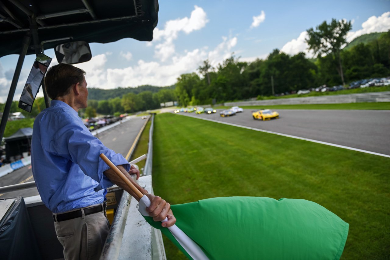  US Senator Richard Blumenthal waving the green flag to start the Northeast Grand Prix.  