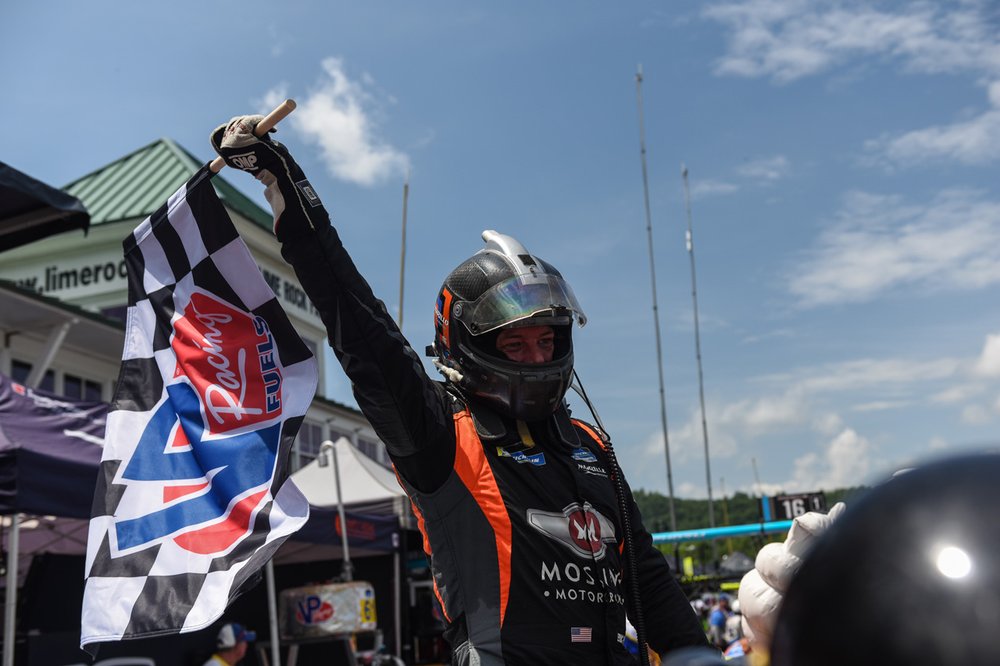  Eric Foss of Murillo Racing celebrates in pit lane after winning the MPSC race duing IMSA weekend in July.  
