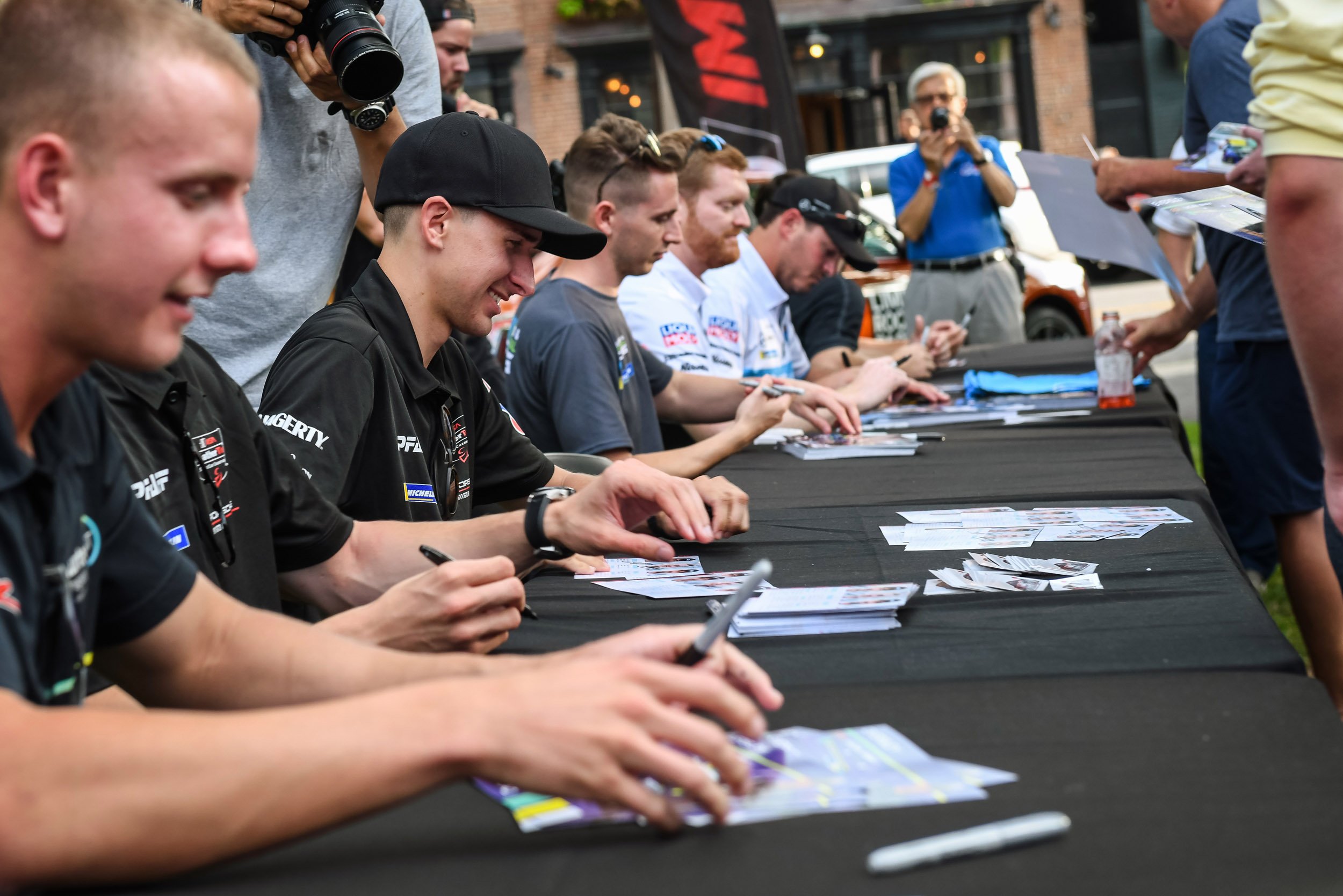 Driver autographs during Fan Fest