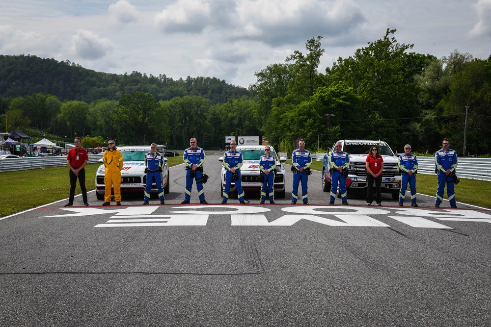 The IMSA safety crew during the national anthem