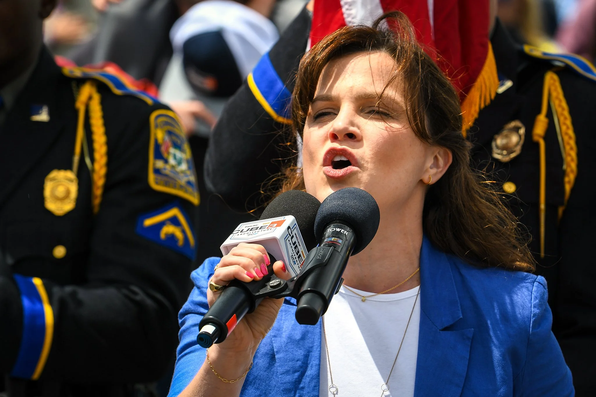  Katie Weiser, of Sharon Playhouse, singing the National Anthem during pre-race ceremonies.  