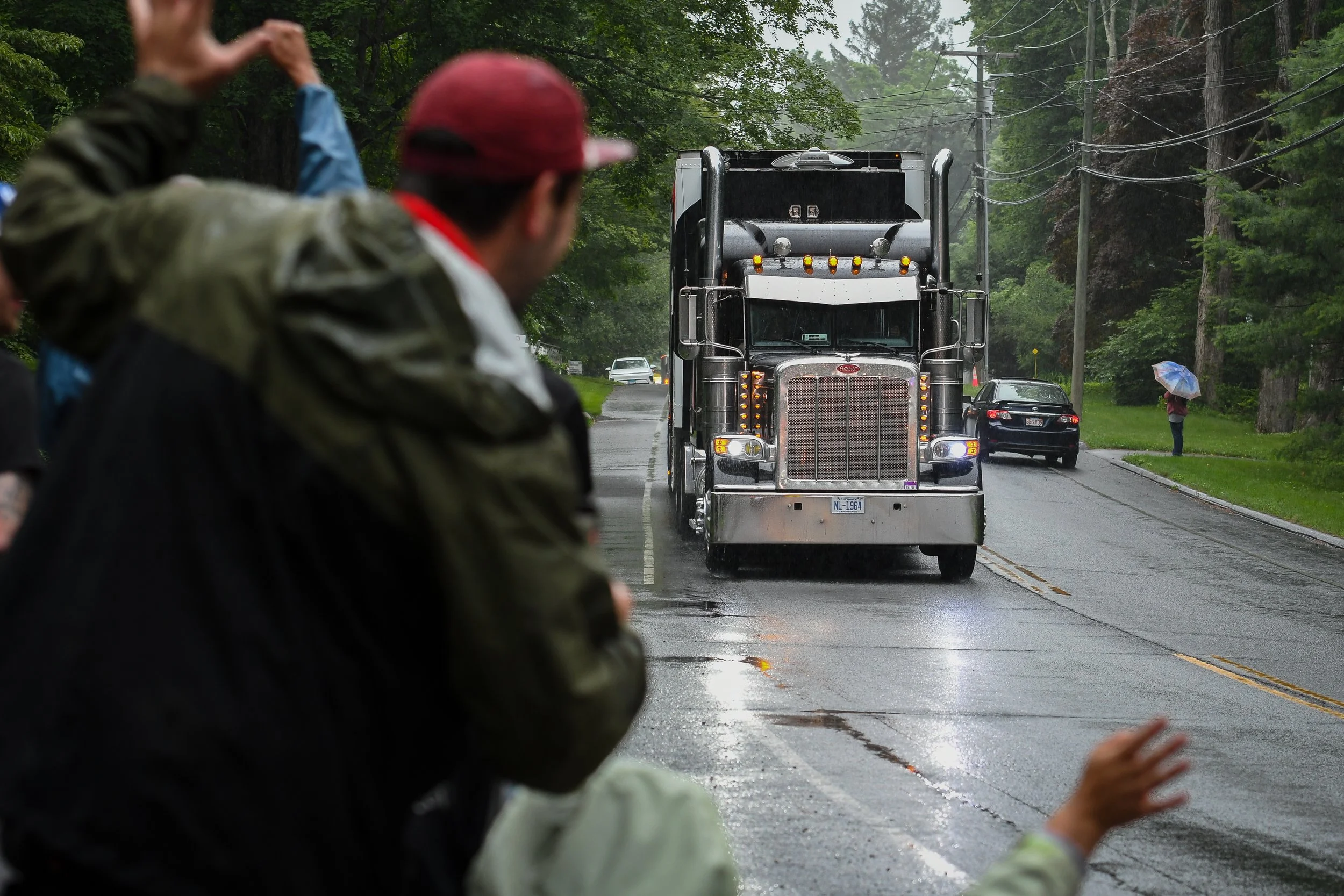  By the time the parade started, the rains came. But a little wet weather never stops the Lime Rock faithful.  