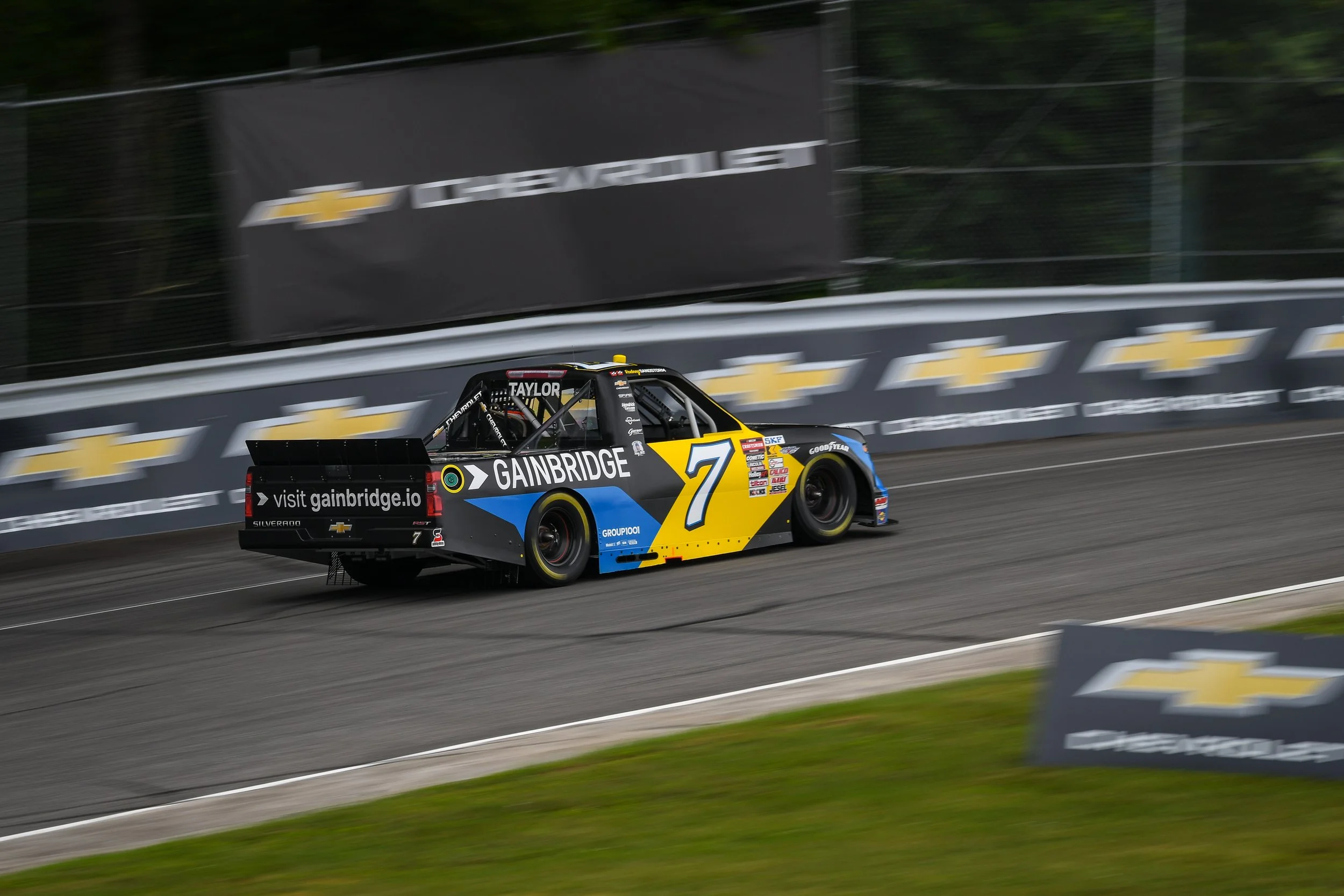  This was the first race after LRP announced Chevrolet as the “official car,” so I was on the lookout to capture that new partnership and this photo does just that. Jordan Taylor (factory Chevy driver at LeMans), driving a Chevy Silverado, surrounded