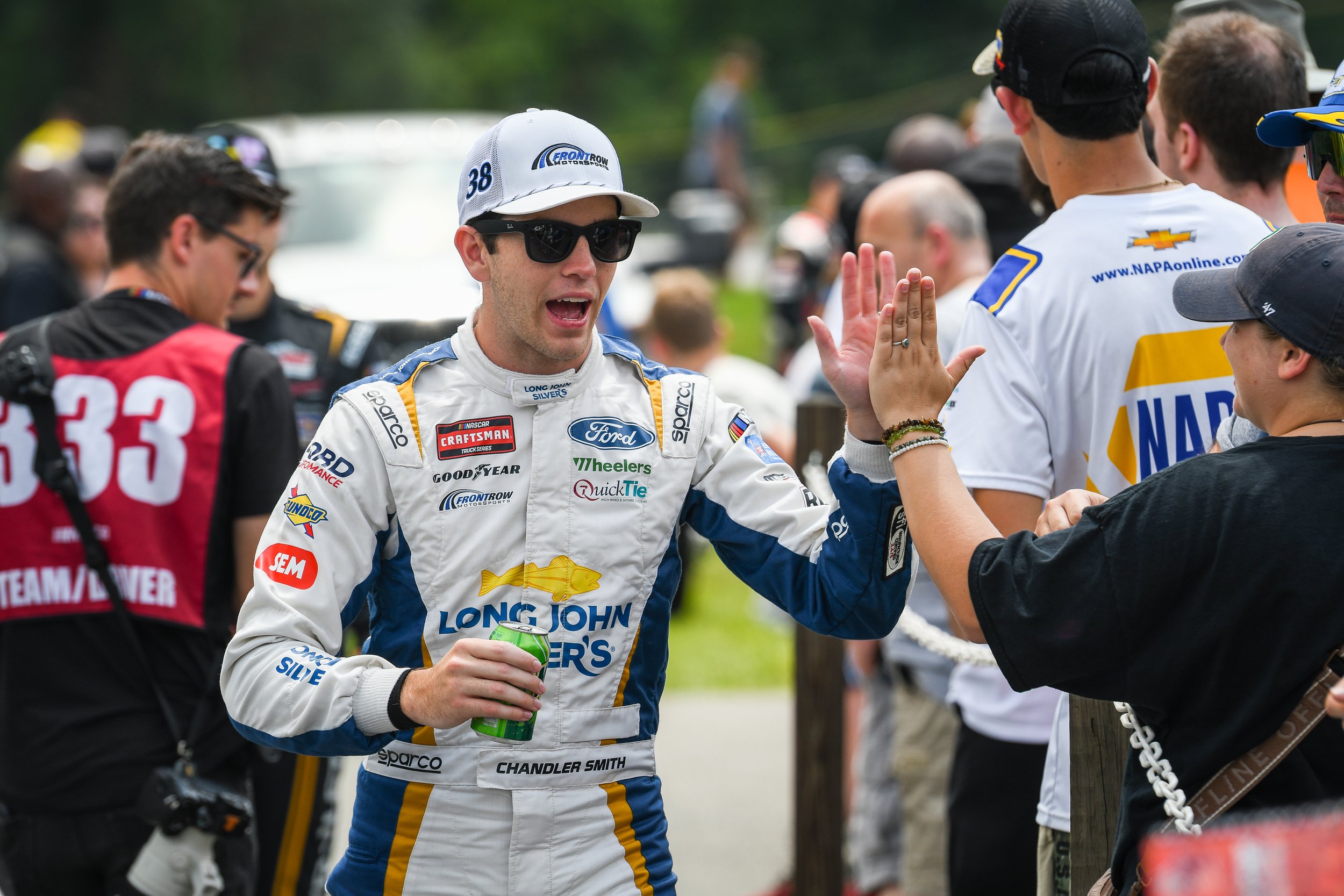  Chandler Smith high fiving fans after the driver introductions.  