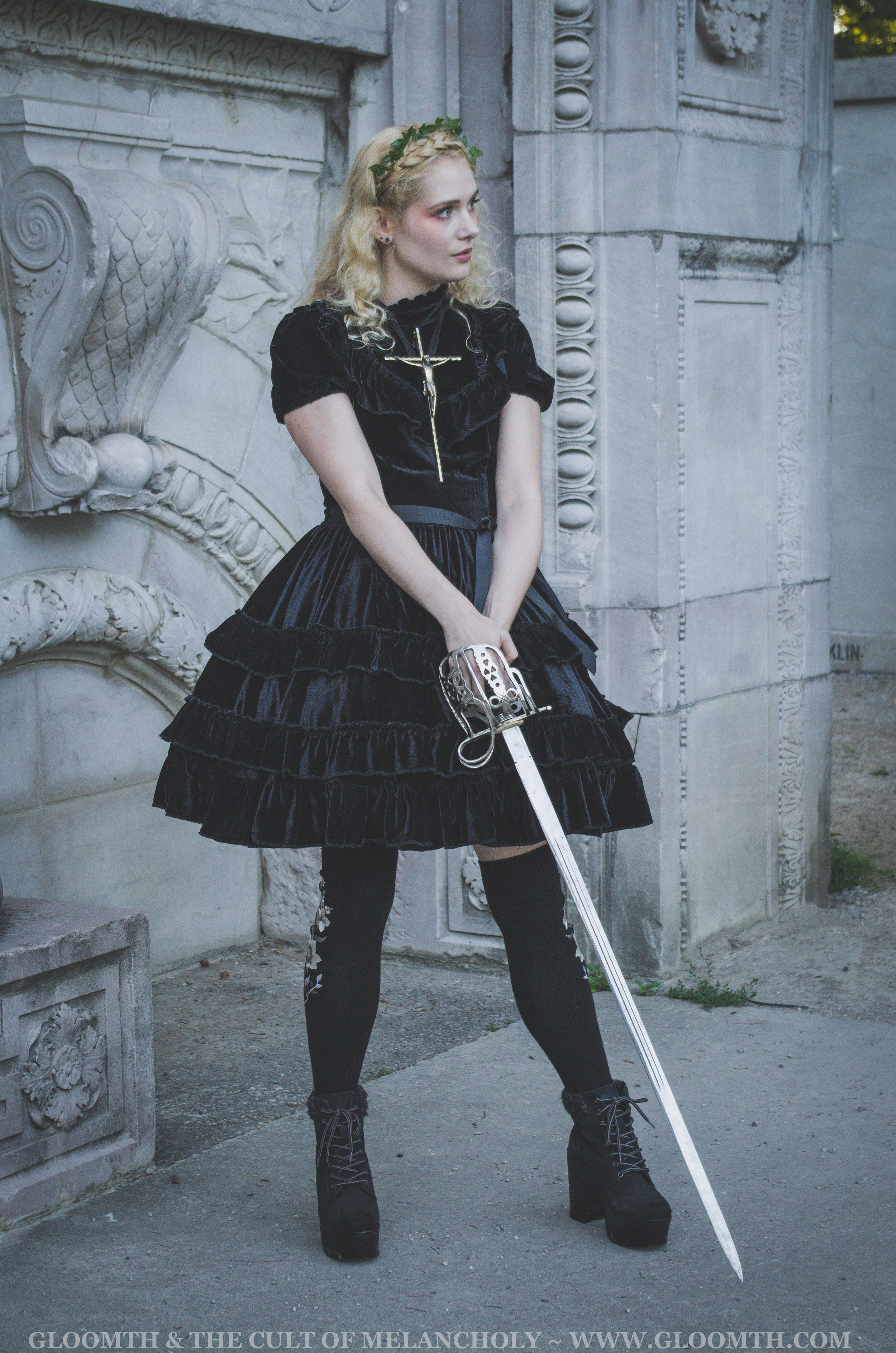 joan of arc with velvet dress and sword editorial