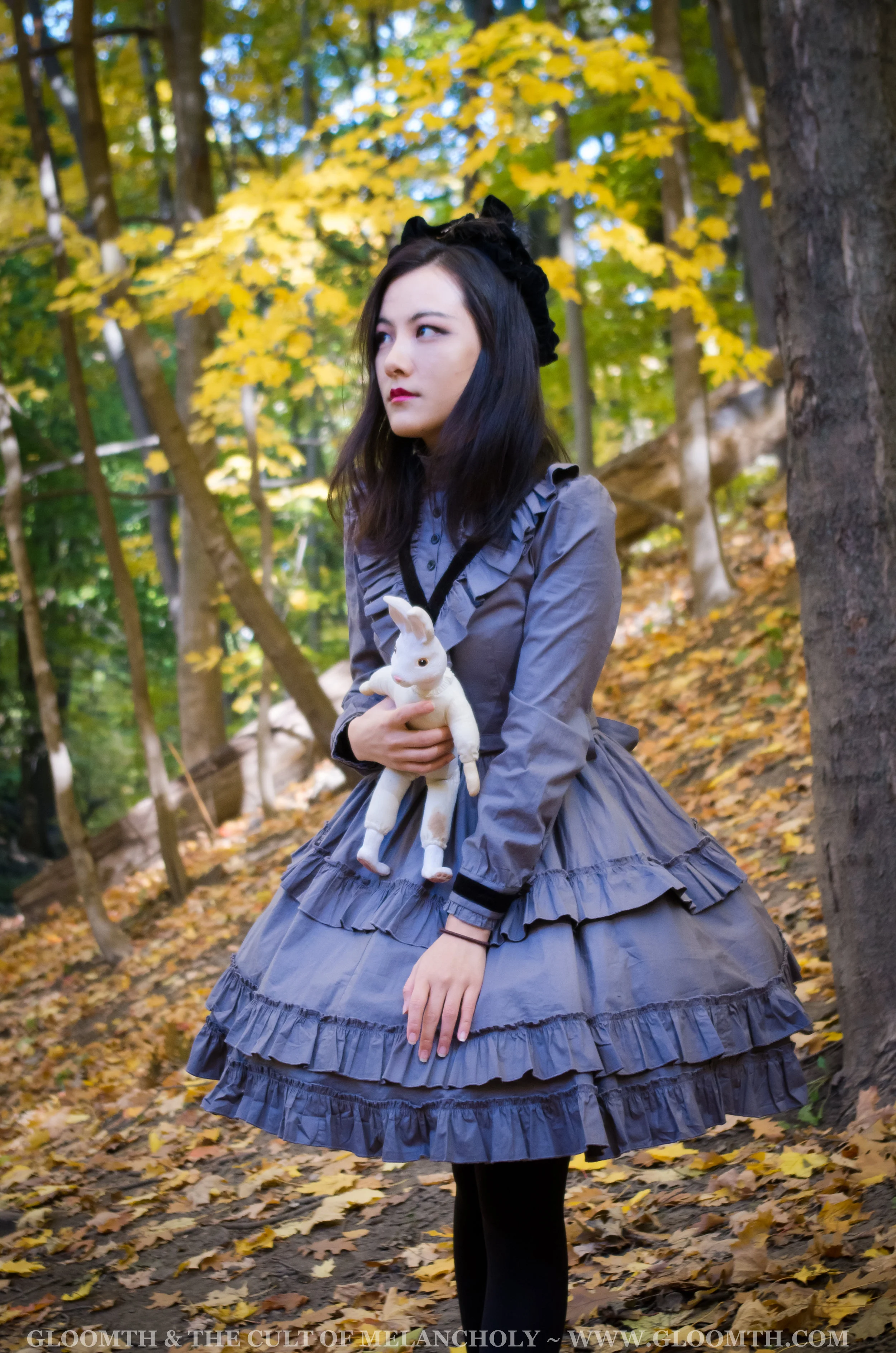victorian lolita girl in autumn forest outfit