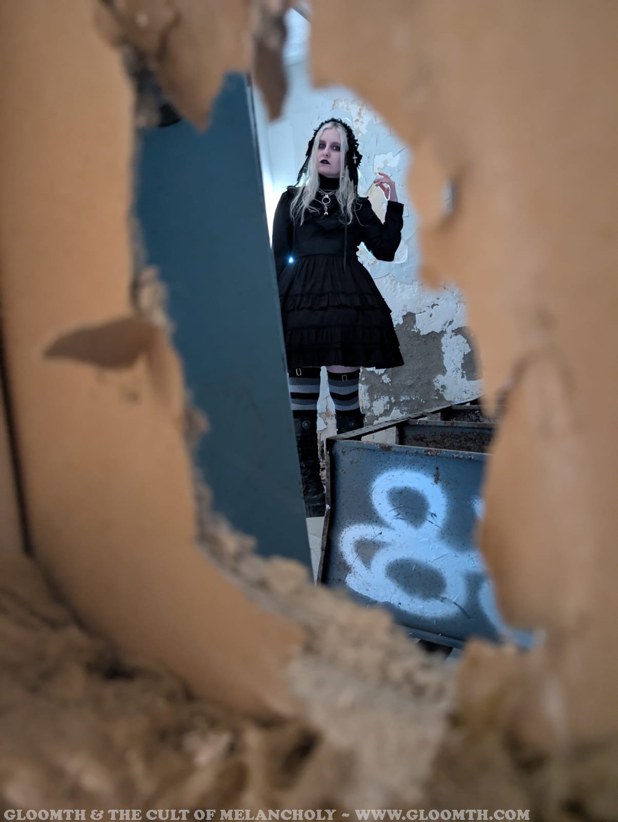 victorian goth in an abandoned building.jpeg
