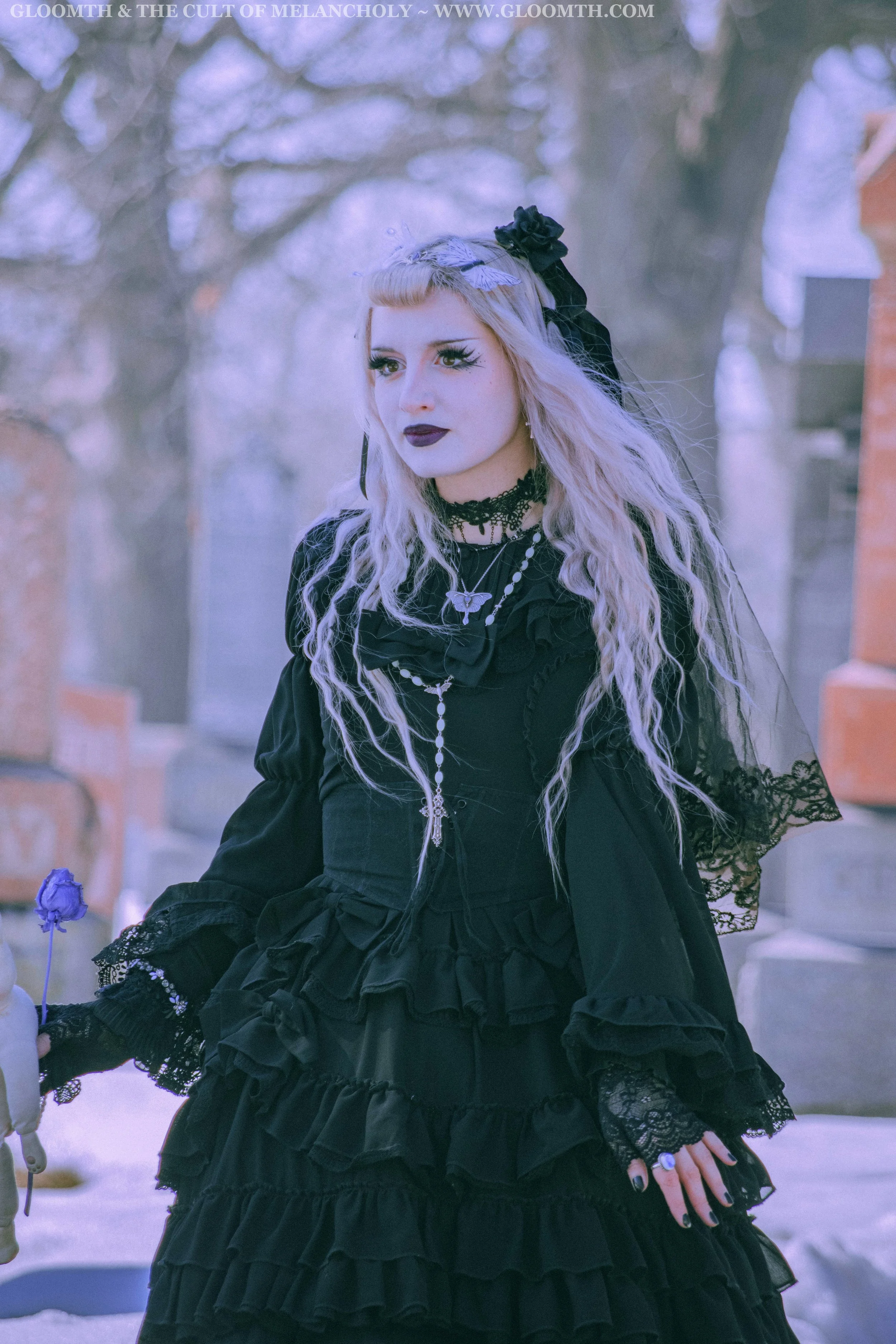 gothic woman in snowy cemetery.jpg