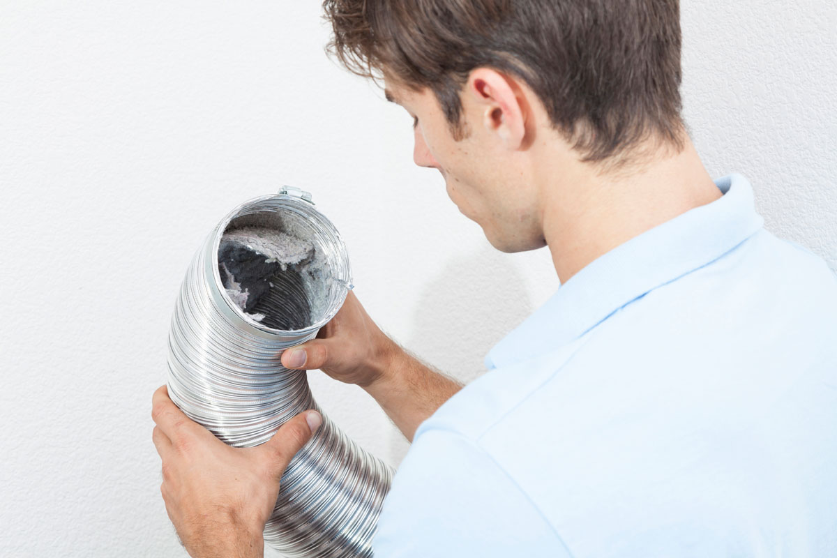 Tech-looking-into-vent-hose.jpg