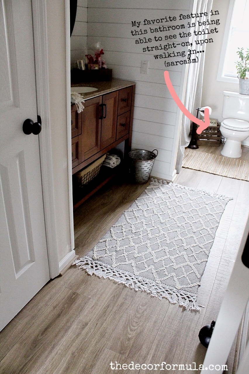 How to Cover Ugly Rental Bathroom Floors with a Vinyl Mat - The