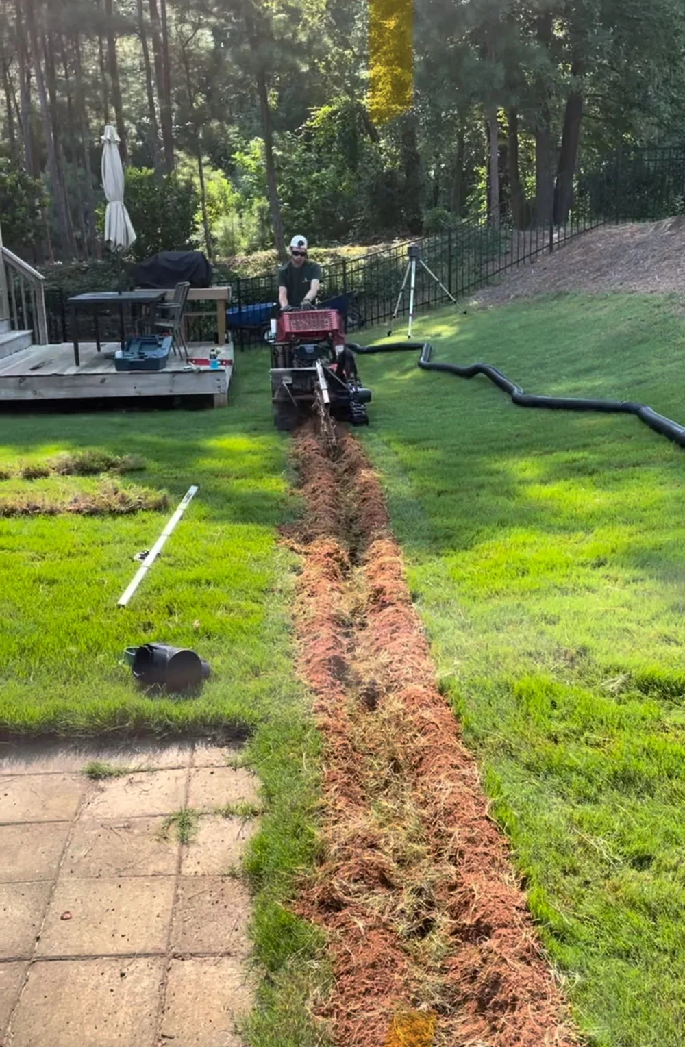 Trenching for drainage pipes to low area of yard
