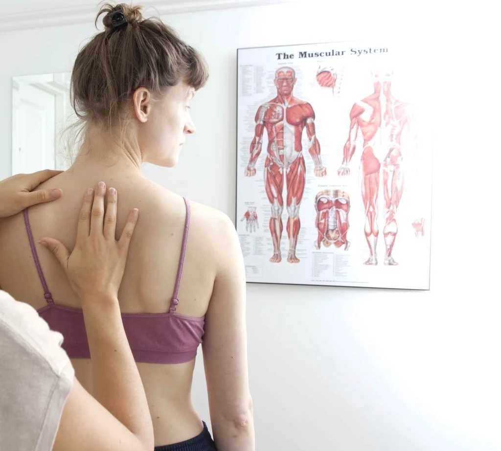 Colette the osteopath performing a standing examination
