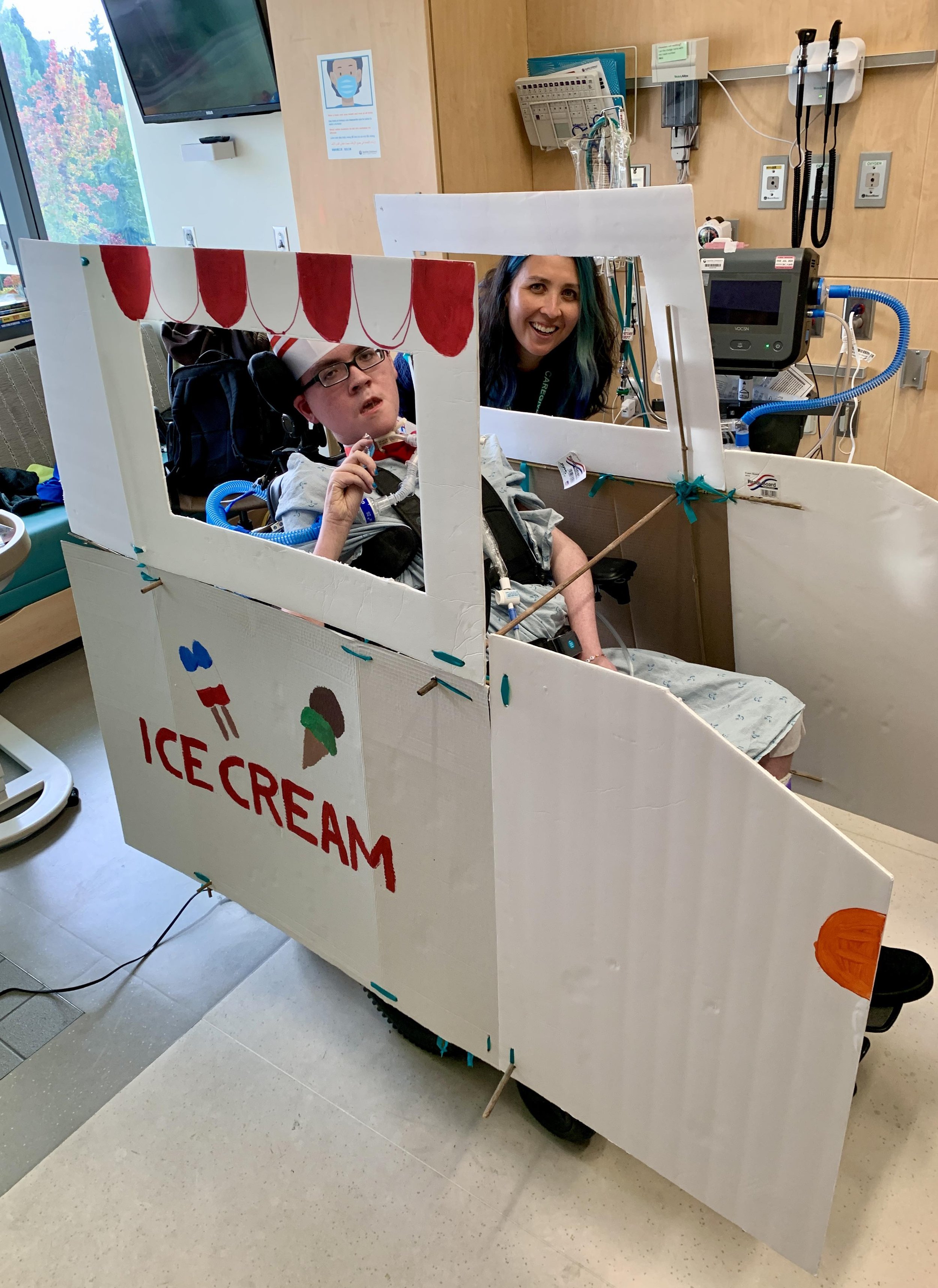 Boy in a wheelchair with an ice cream truck costume