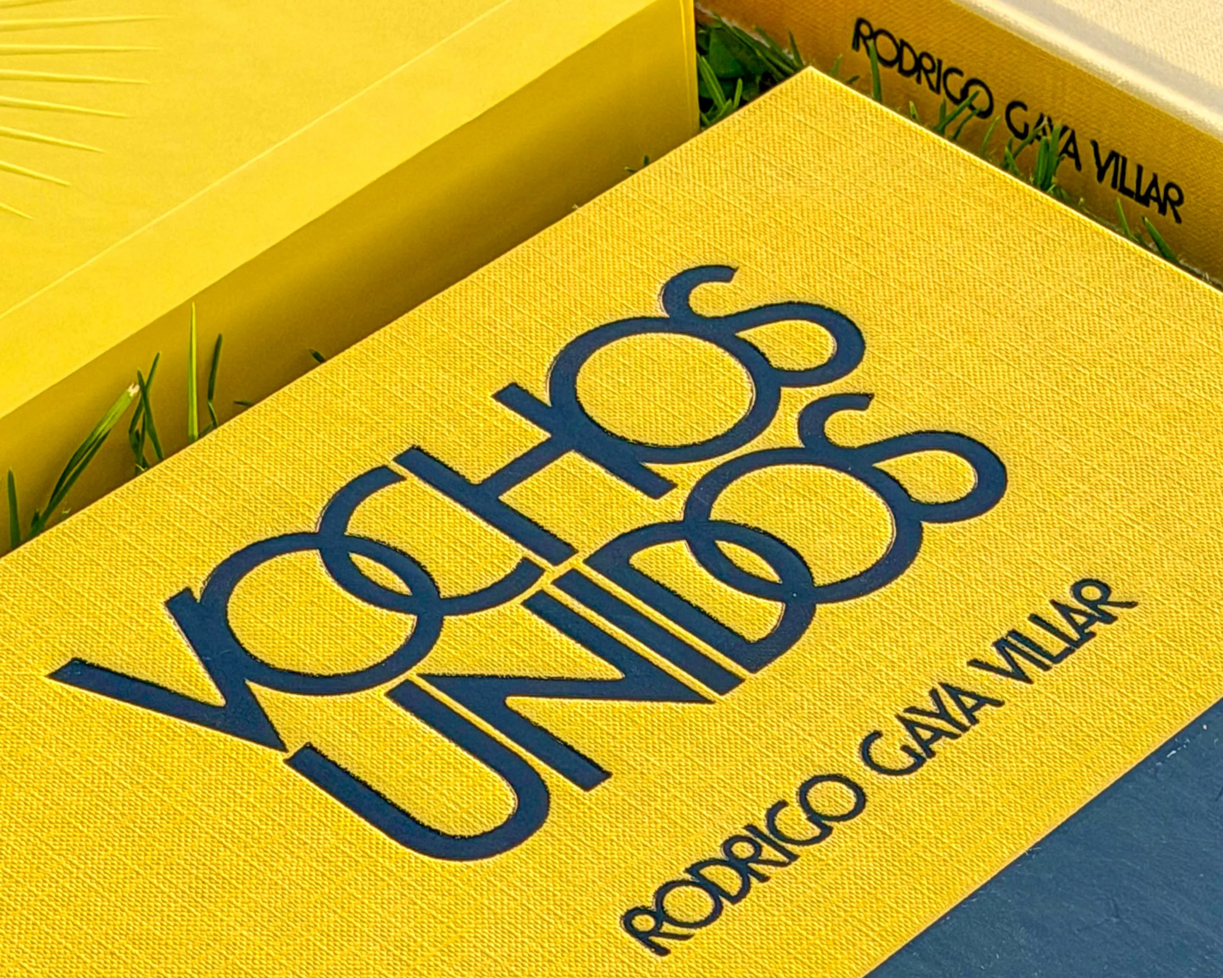 A copy of the automotive photobook Vochos Unidos in yellow hardcover. By author Rodrigo Gaya Villar and published by Carrara Media (2026).