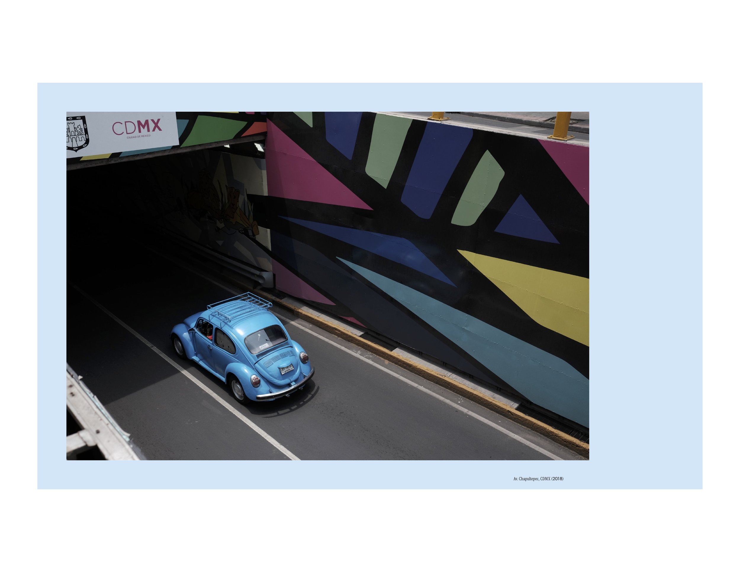 A blue Vocho, or Volkswagen Beetle, descends into a Mexico City tunnel with bright geometric murals surrounding it. From the book Vochos Unidos by Rodrigo Gaya Villar, published by Carrara Media, 2026.