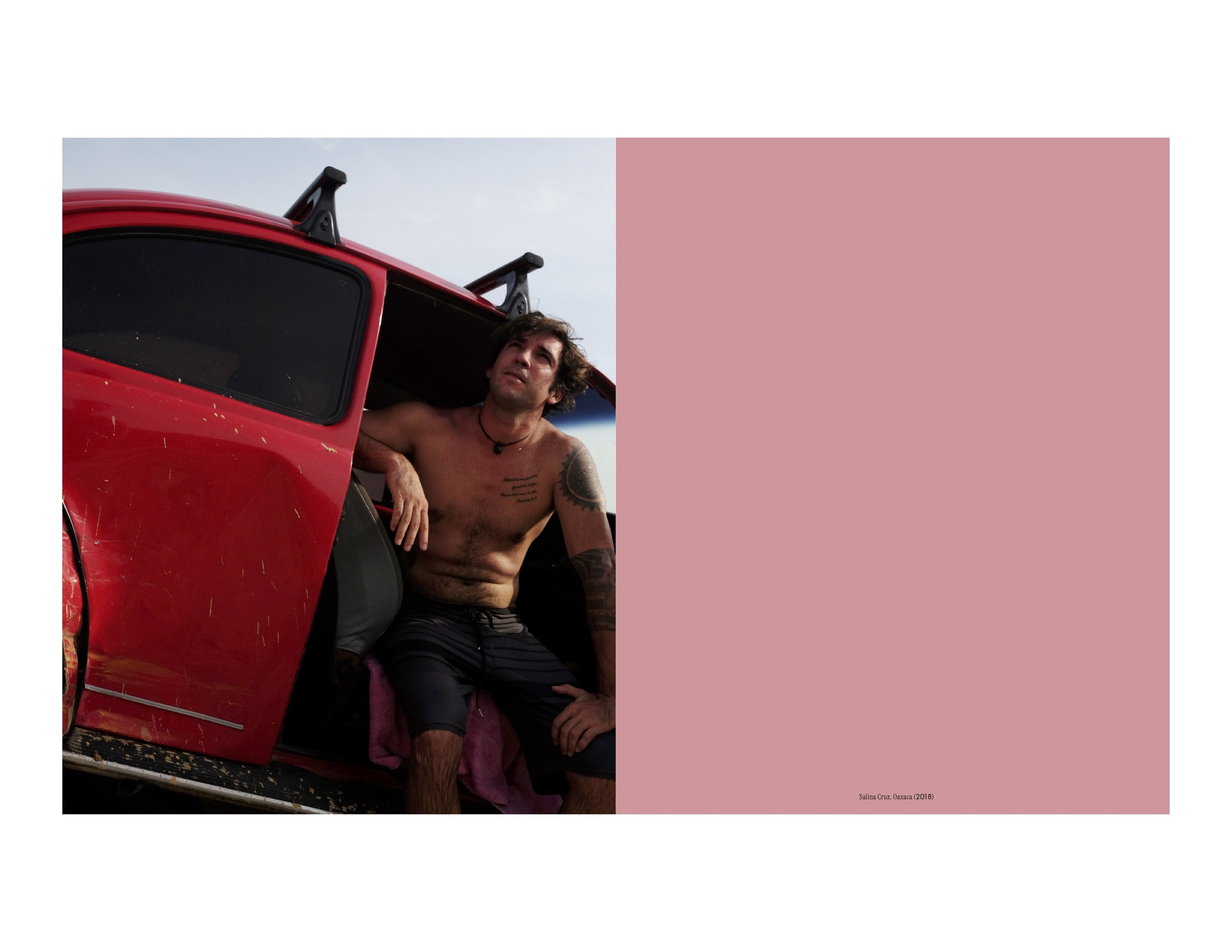 A shirtless man sits in the open door of his red Vocho, or Volkswagen Beetle, in a break between surfing sessions on a beach in Oaxaca, Mexico. From the book Vochos Unidos by Rodrigo Gaya Villar, published by Carrara Media, 2026.